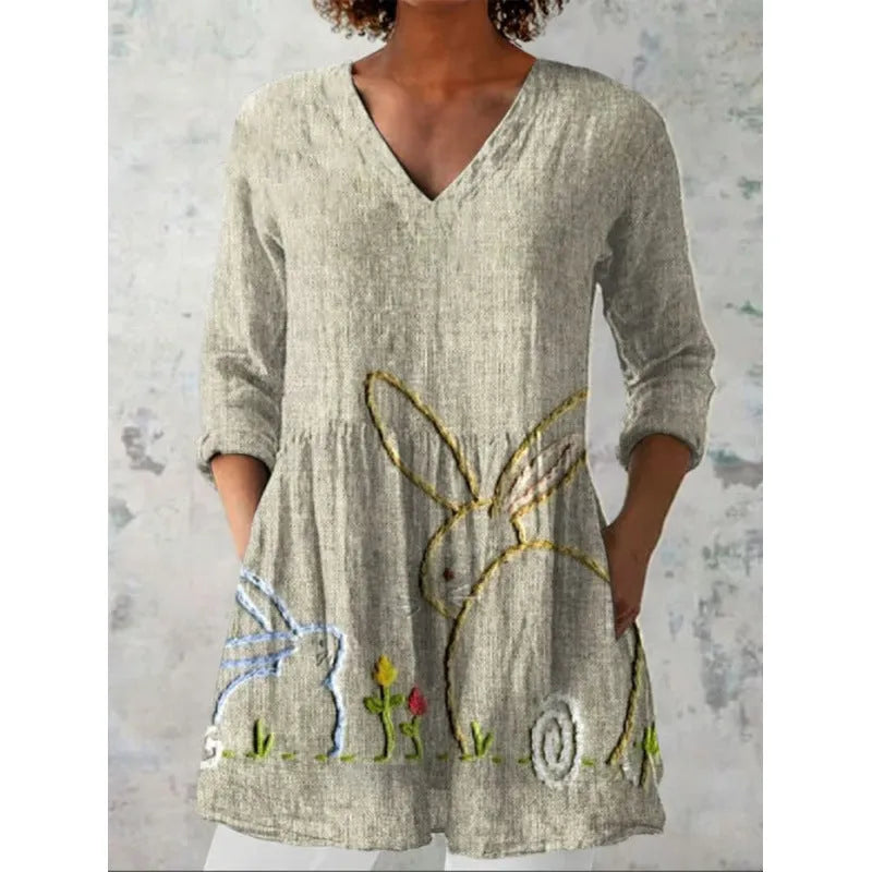 Women's printed loose-fit maxi dress with wide waist and three-quarter length sleeves.