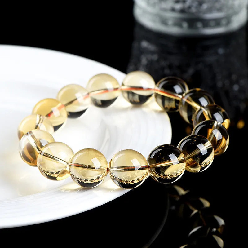 Natural citrine scattered beads ball bracelet in 7A grade colour on a wrist.