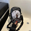 Halloween-themed crossbody phone bag with cartoon pumpkin, ghost, and bat print.