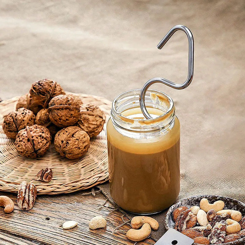 Stainless steel peanut butter mixer sauce stirring rod on white background