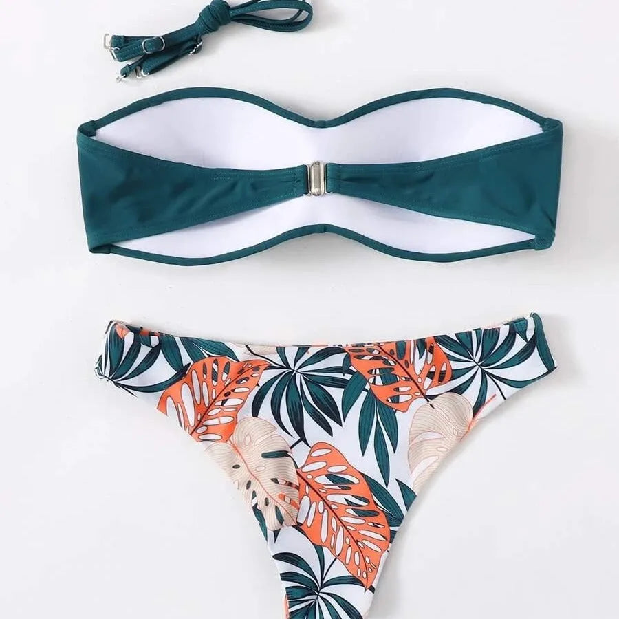 Split push up bikini swimsuit set in green on a mannequin, showing top and briefs style.