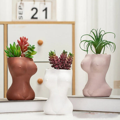 European style ceramic flower pots with decorative figures and gods in white, pink, and brown
