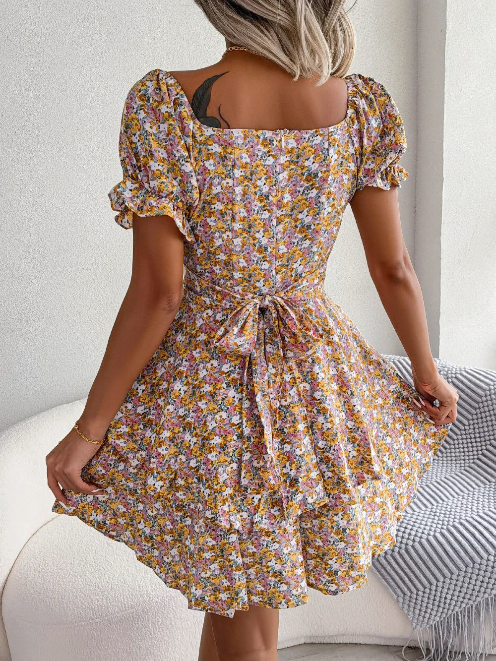 Stylish floral mini dress with ruffled hem, high waist, and short sleeves in various colors