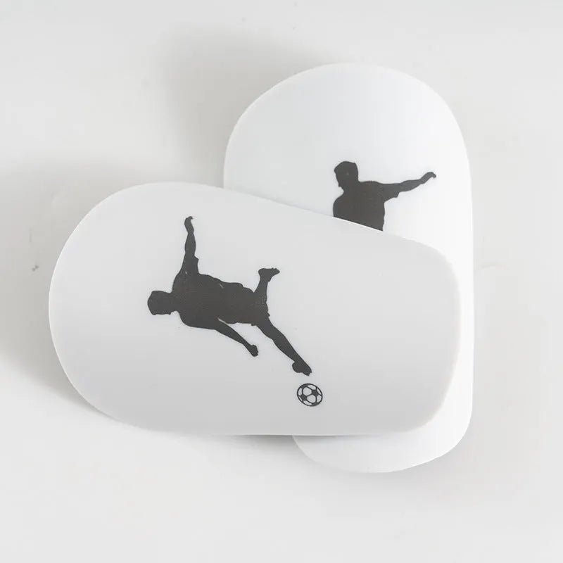 Mini football leg protector in black PU material, size XS, measuring 8 cm by 5 cm