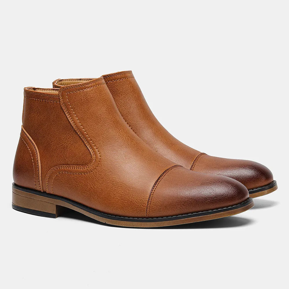 Men's brown Chelsea ankle boots with a side zip, shown on a foot.