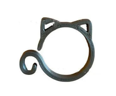 A green cat-shaped plastic plant clip for securing stems to garden supports.