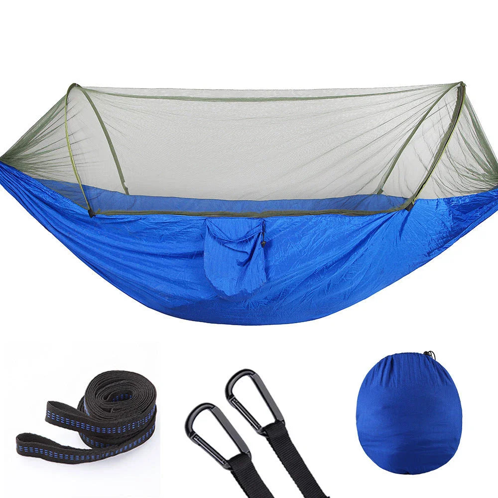 Quick-setup hammock with mosquito net for outdoor adventures, featuring durable materials and easy setup.