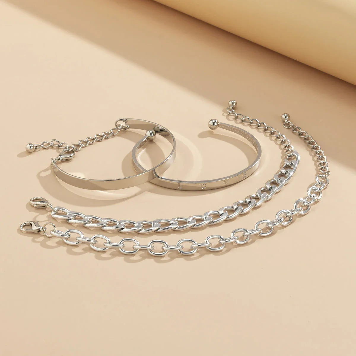 Stylish C-shaped hollow chain bracelet set in gold and silver colours, featuring a sleek and contemporary design