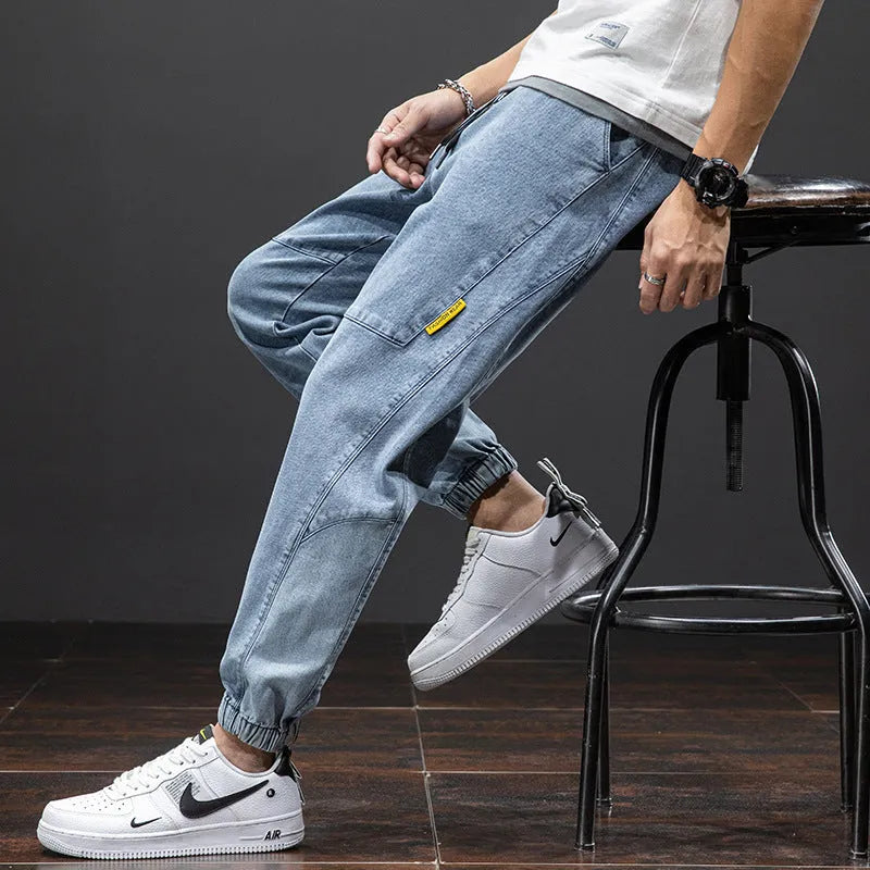 Men's loose fit cargo casual jeans in blue, showing straight leg and Korean style design.