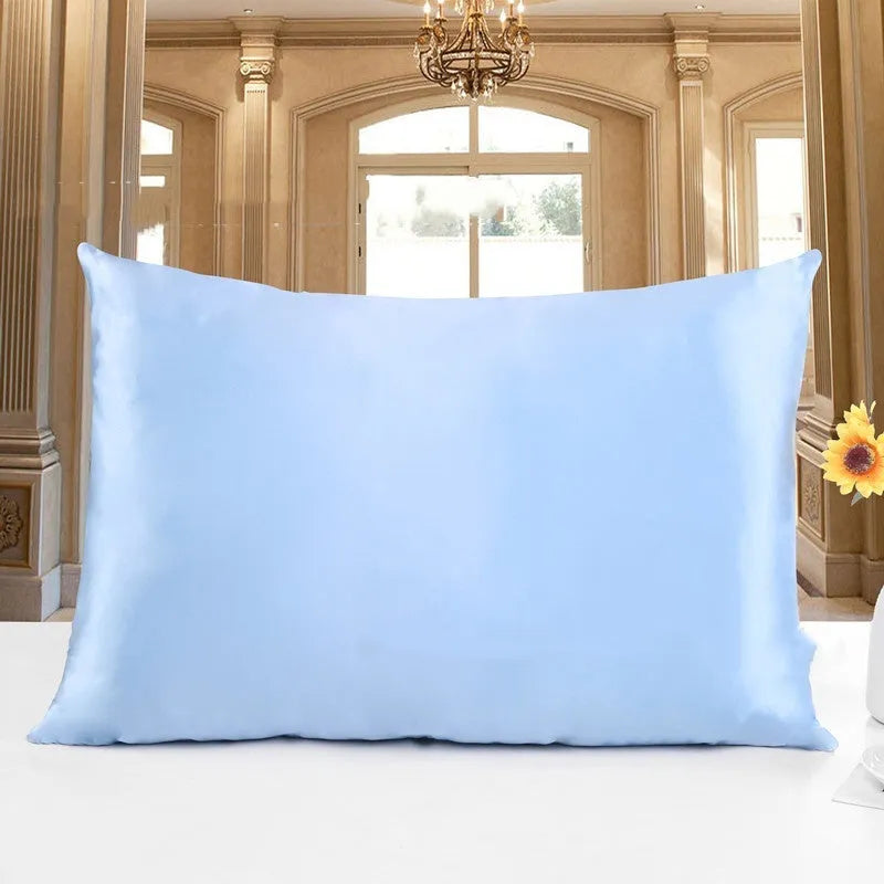 19 M double-sided silk pillowcase shown in one of 14 colours, including apricot, champagne, and navy blue.