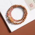 Brown wooden bracelet with 6mm round beads featuring double circle pattern