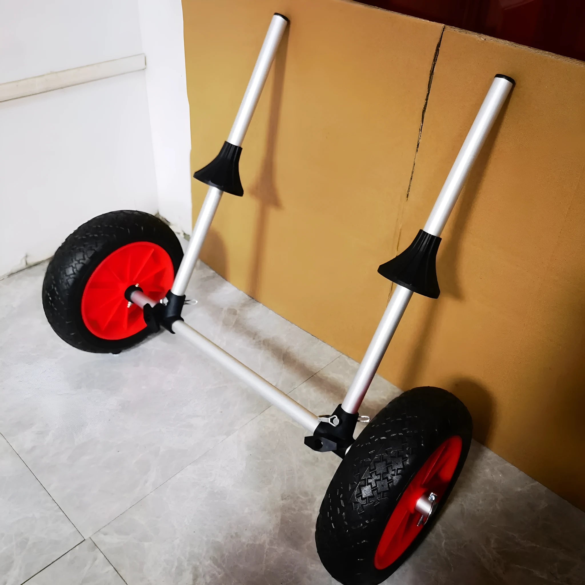 Foldable aluminium kayak beach trailer with rubber wheels and an upright plug-in pole for boat transport.