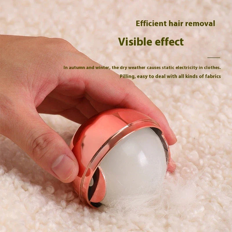 Reusable Pet Hair Remover Ball in Liquid Silver and Rose Gold colors, featuring hydro-slips technology and diatom mud for effective cleaning of clothes, furniture, and surfaces.