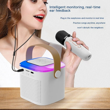 Portable karaoke machine with dual wireless microphones and RGB lighting