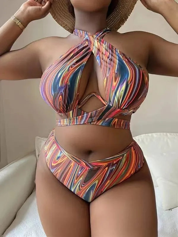 Women's floral print high-waisted bikini swimsuit with split sides.