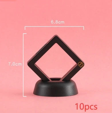 3D floating jewelry display stand showcasing earrings and coins in mid-air