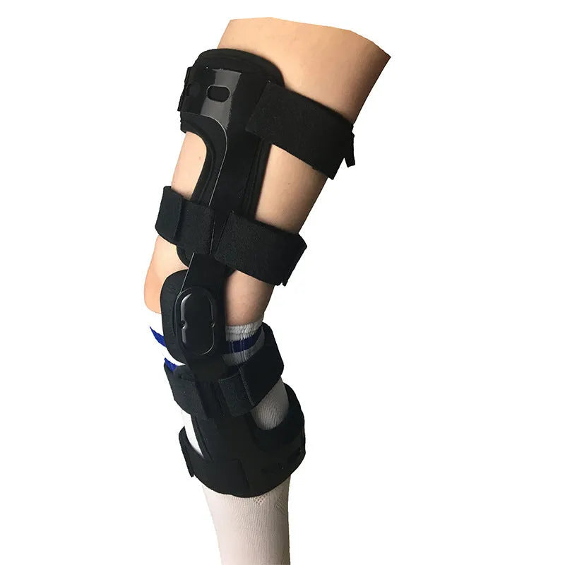 Black anterior ligament knee supporter with adjustable straps and hinge joints shown in size M-R format
