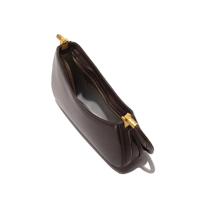 Women's oval-shaped retro underarm bag in various colours with a single shoulder strap.