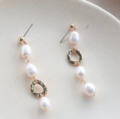 Vintage geometric pearl asymmetric earrings with 925 silver hooks, perfect for adding elegance to any outfit.