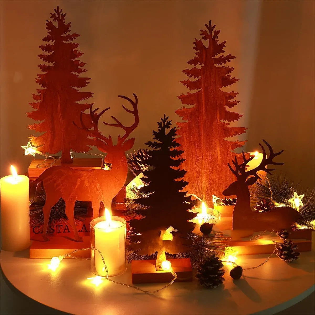 Three rustic iron metal Christmas tree ornaments featuring elk silhouettes, American style.