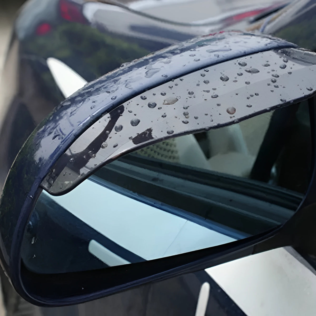 Car rearview mirror rain protection eyebrow set in black PVC on a vehicle side mirror