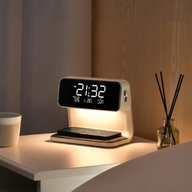 White 3-in-1 bedside lamp with wireless charging pad, LCD alarm clock screen, and touch-sensitive dimming control.