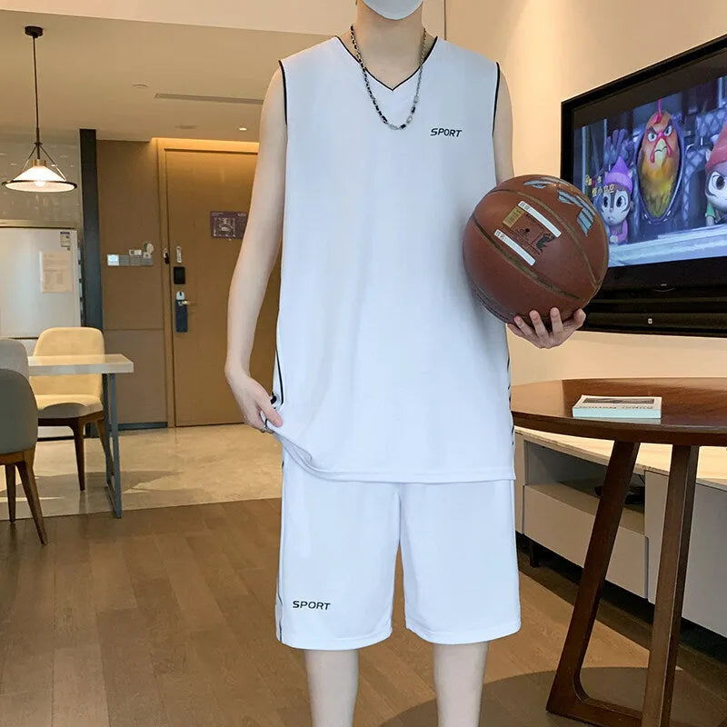 Men's white sleeveless basketball vest and matching shorts sportswear set laid flat.