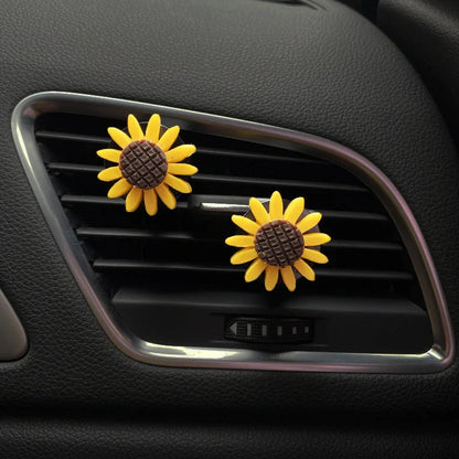 Yellow sunflower car vent perfume clip measuring 8cm with secure mounting clip for air freshening