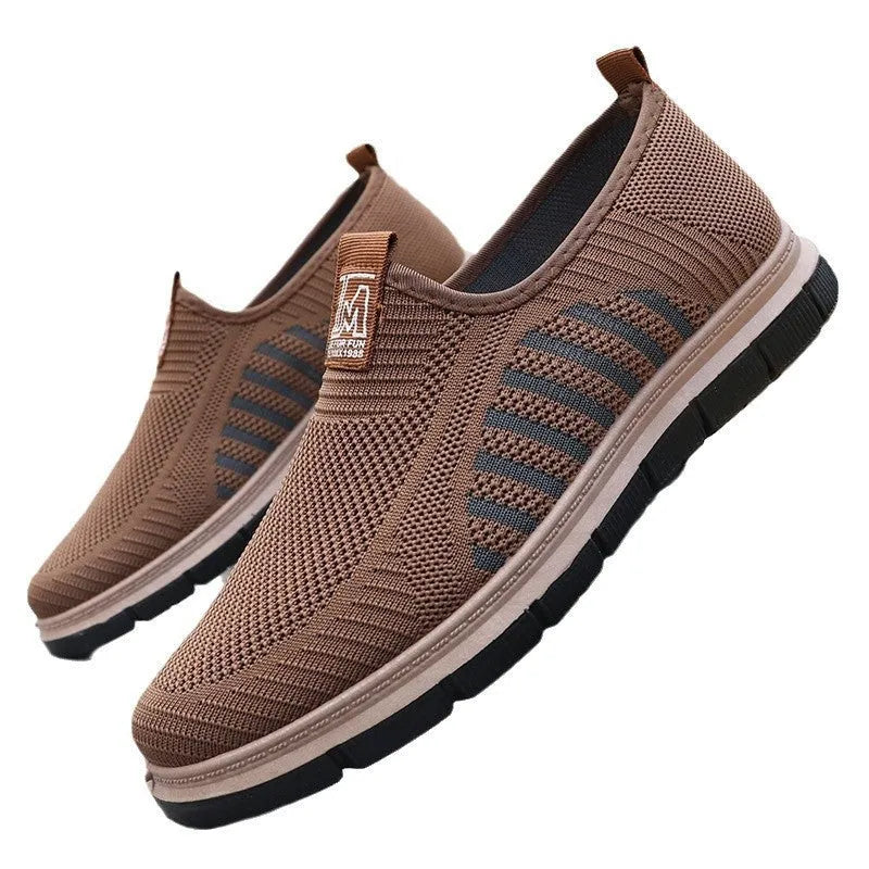 Slip-on soft bottom casual sneakers for men in black with mesh upper and low-top design