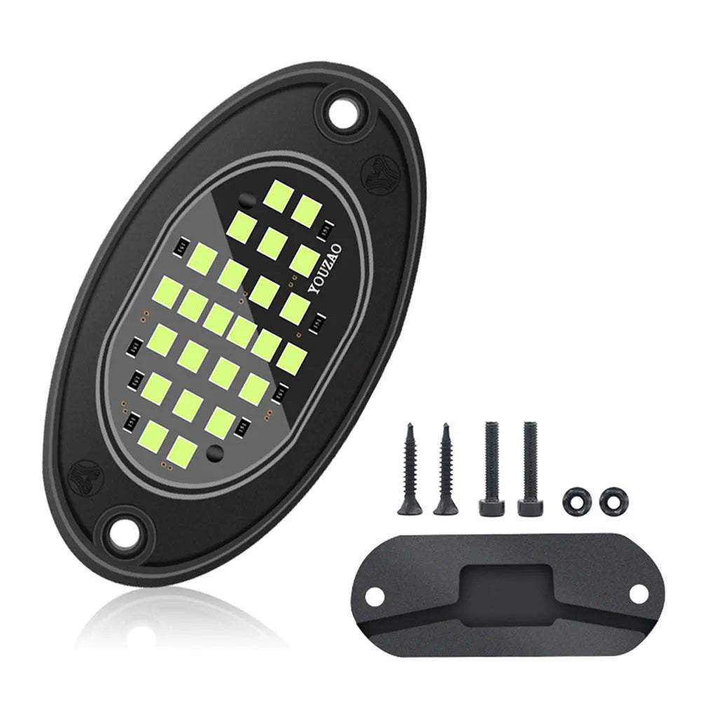 12V car LED chassis ambience light in ABS housing with five colour options on a dark vehicle underside