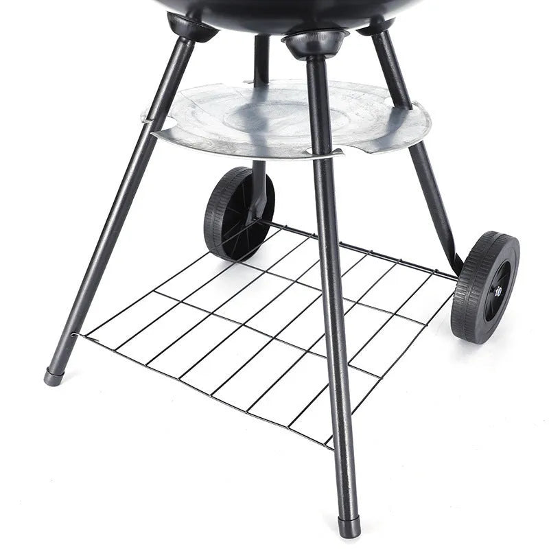 Portable 14-inch iron barbecue grill with a minimalist design on a patio.