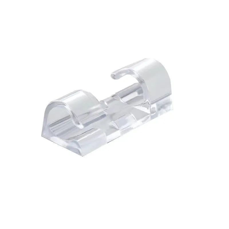Transparent self-adhesive plastic cable management clips in four sizes on a white background.