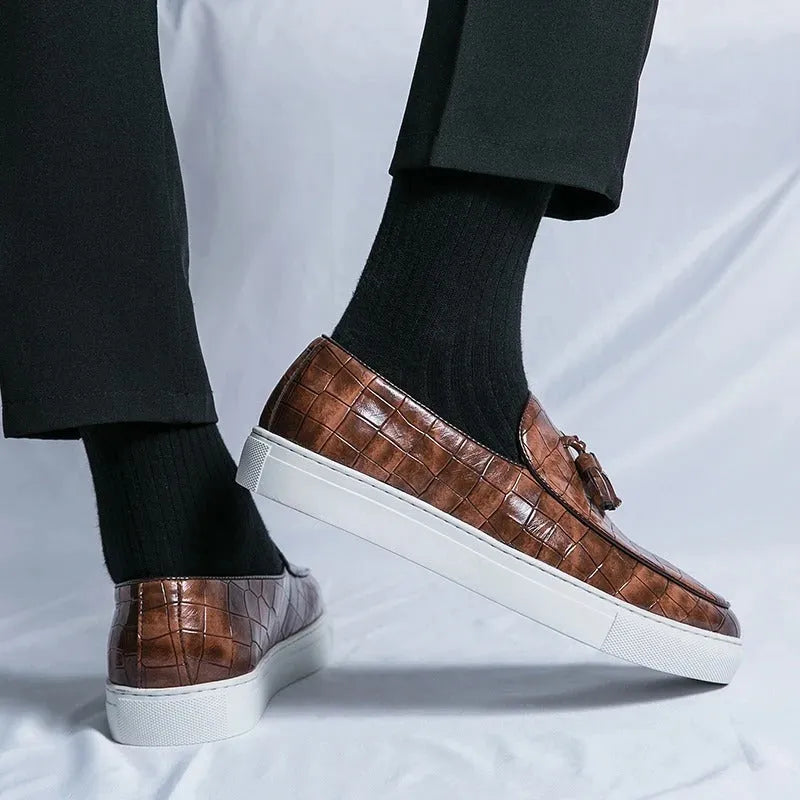 Men's black artificial PU sneakers with tassel detail and a round toe, displayed on a white background.
