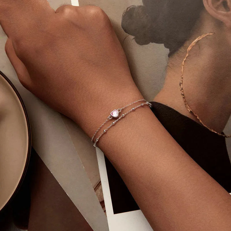Women's sweet style sterling silver 925 bracelet with small heart-shaped charm on an adjustable chain.