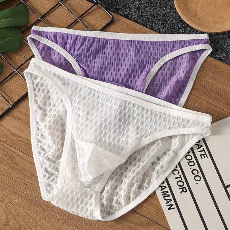 Men's low waist transparent nylon lace underwear in a solid colour with text print.