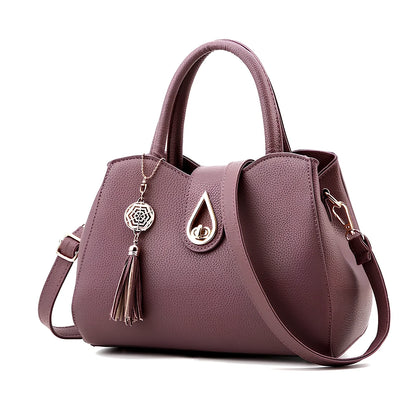 Women's litchi pattern PU leather tote bag with zipper closure and adjustable shoulder strap showing internal pockets