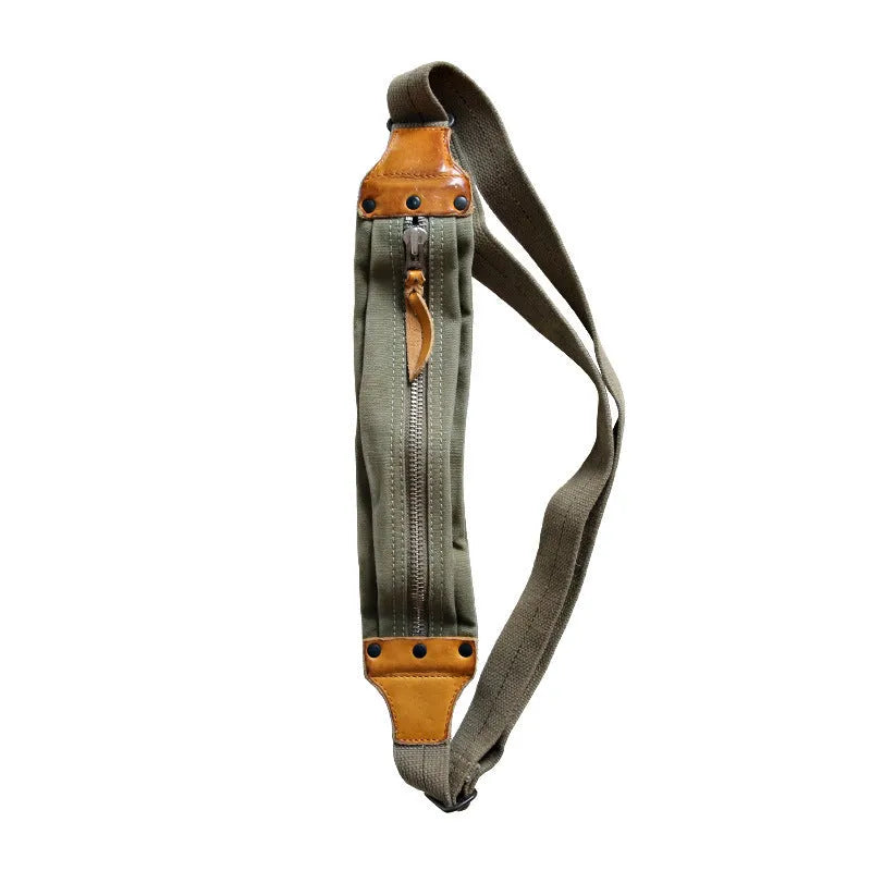 Green retro military style chest bag with washed canvas and cowhide leather detailing