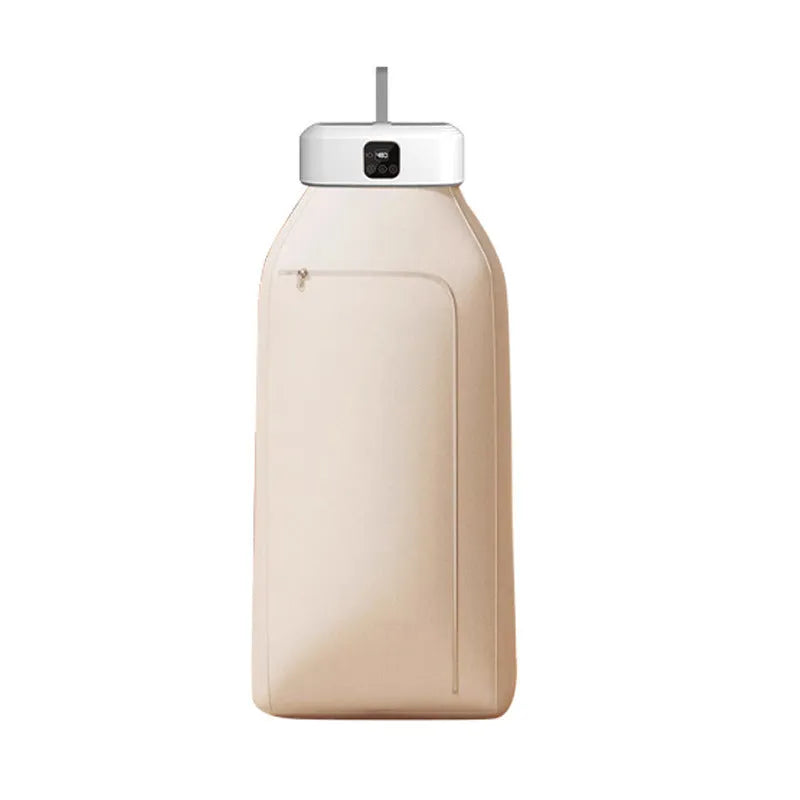 White cylindrical foldable clothes drier with remote control on a table.