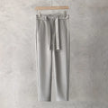 Boys slim straight tapered wool trousers in grey, shown with a straight leg opening.