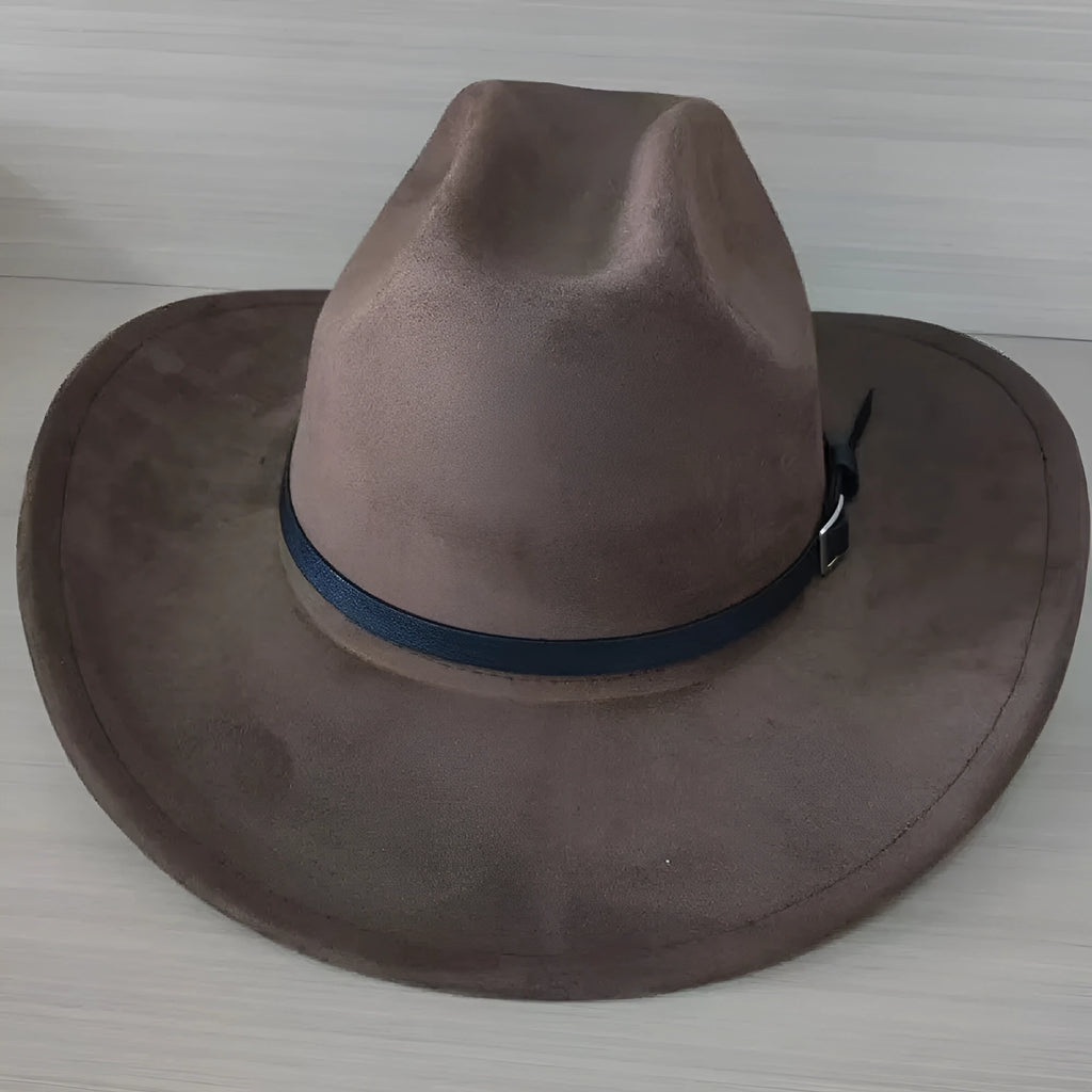 Brown leather velvet curved edge cowboy hat with a conical crown on a plain background.