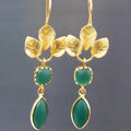 Gold coloured retro drop earrings with a French leaves charm and dangling chain-tassel detail.