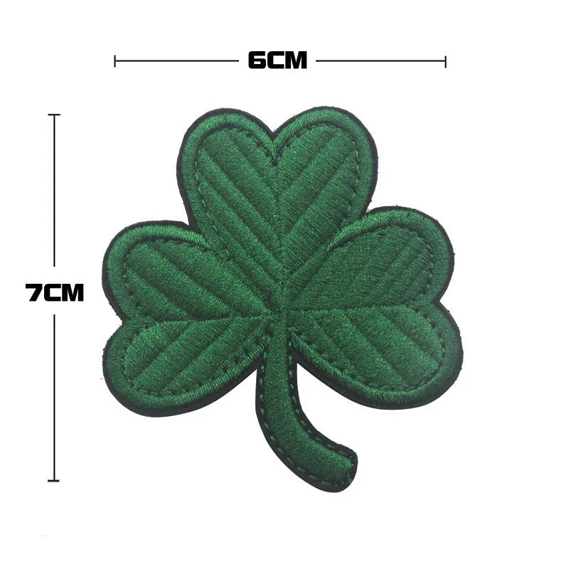 Embroidered fabric badge with hook and loop backing in military green colour for tactical gear attachment