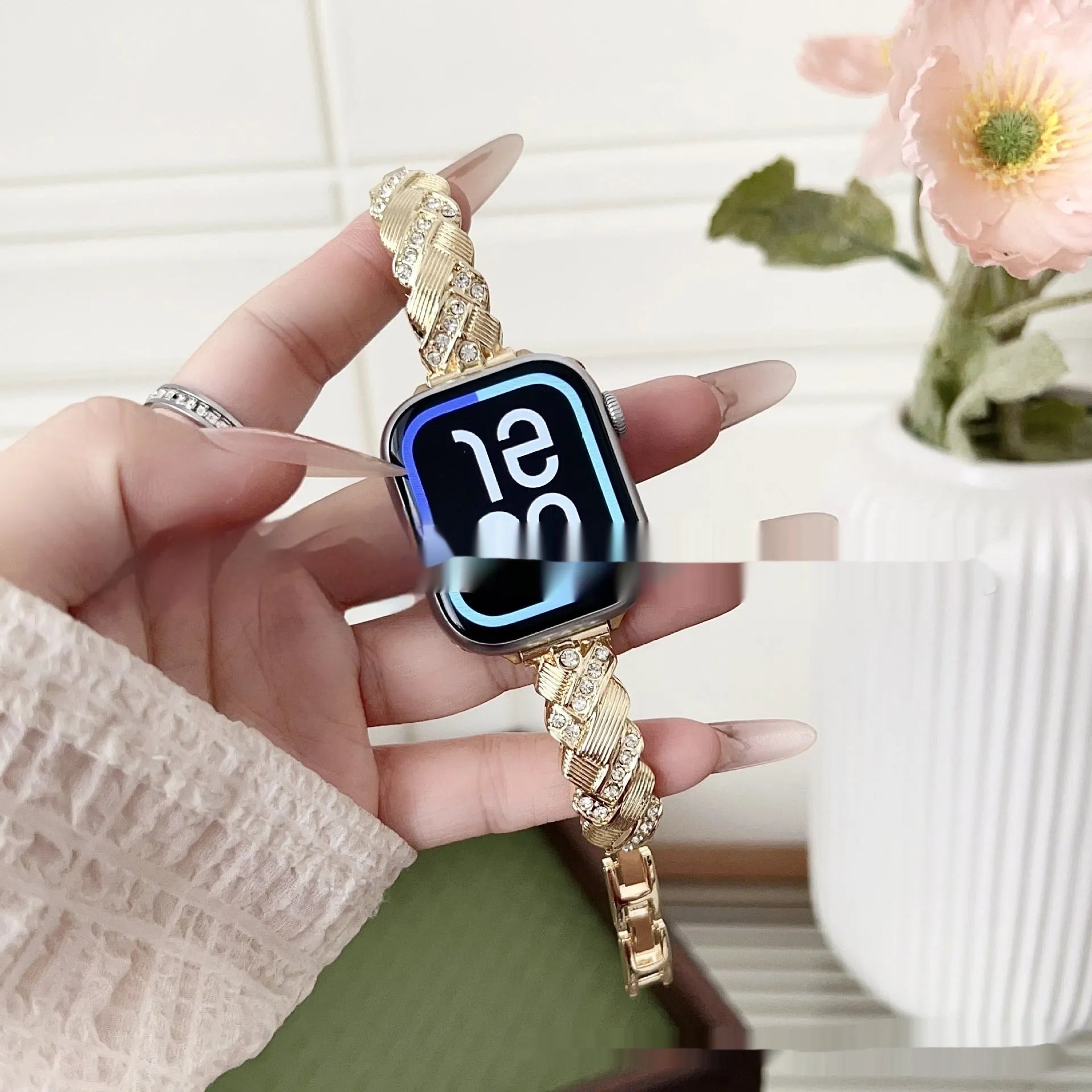 Zinc alloy metal Apple Watch band with twist and diamond design in silver, rose gold, gold, black, and Starlight colours.