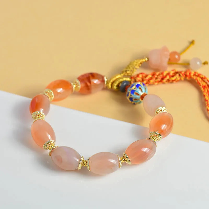 Jinsi jade agate Tibetan bracelet with carved lily flower motif and geometric shapes