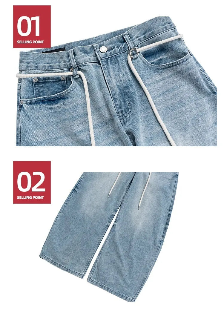 Blue vintage washed denim straight-leg trousers with drawstring belt and zipper fly closure
