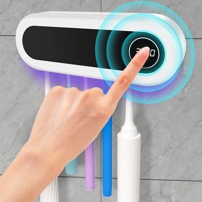 Wall-mounted toothbrush holder with UV sterilizer and toothpaste dispenser in ivory white