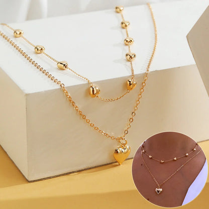 Double-layer heart pendant fine chain necklace in gold colour with adjustable length