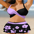 Women's purple bikini swimsuit with matching skirt showing lace-up design and high-waist brief style