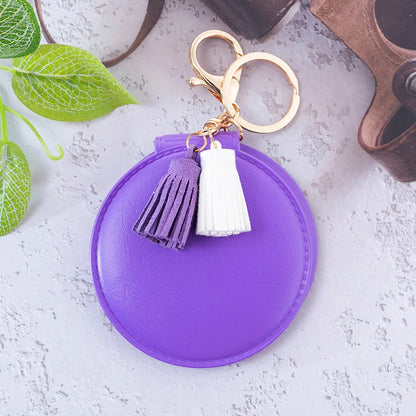 Mini round PU leather small mirror with tassel in various colours