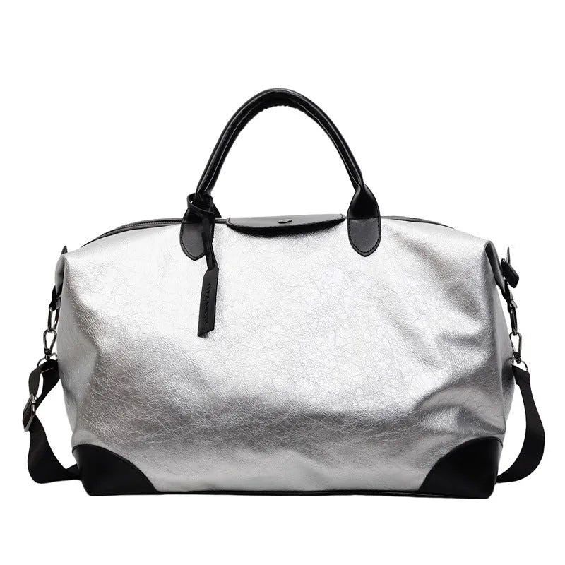 Women's hand-carry travel bag in black or silver with 36-55 litre capacity and PU material construction